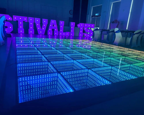 LED dance floor with colorful lighting and 'FESTIVAL' letters in the background.